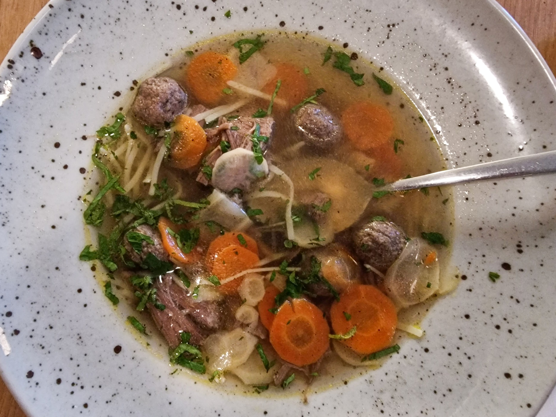Hovězí vývar – Beef broth with liver dumplings and noodles.