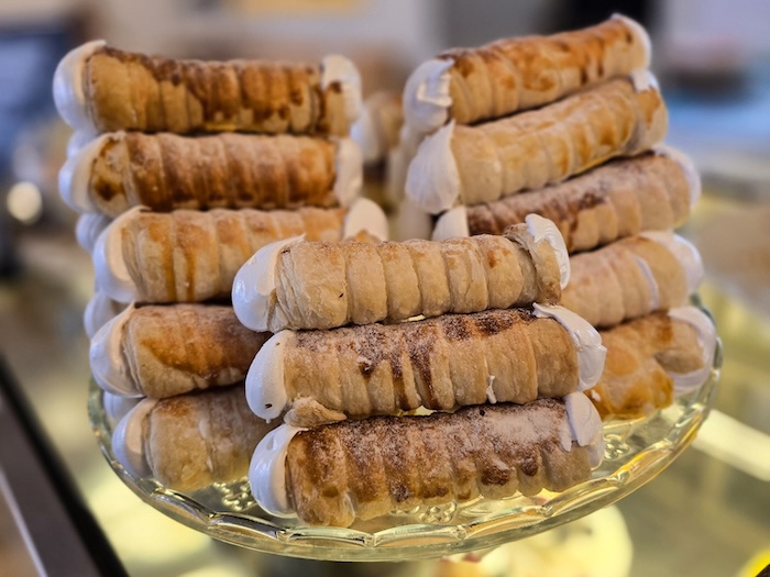 Kremrole – Crispy puff-pastry roll filled with sweet meringue cream.